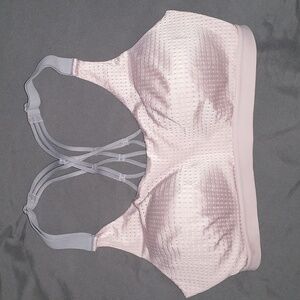 Light pink Victoria's Secret Sports Bra with gray straps.